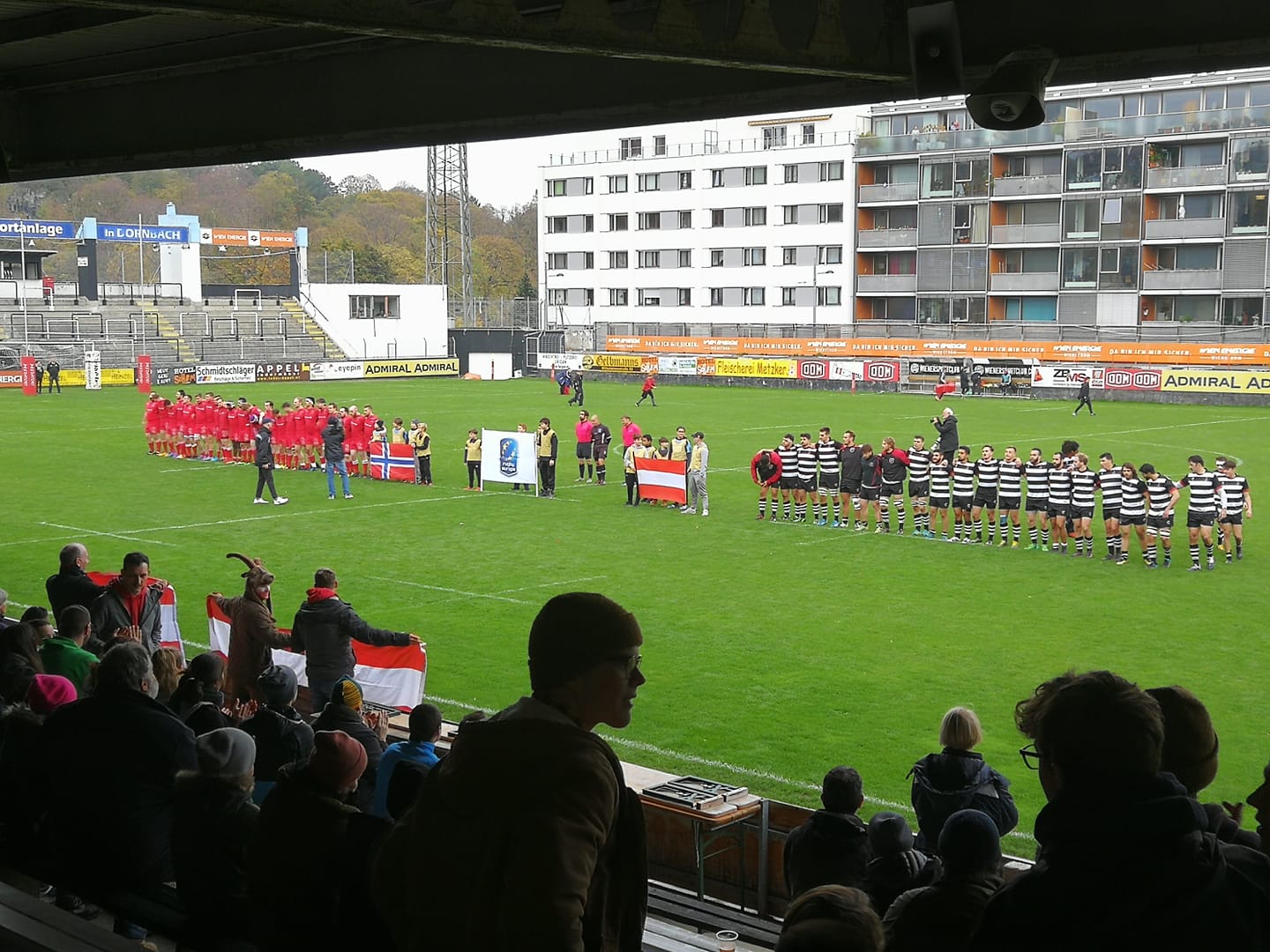 The teams line up for the national anthems